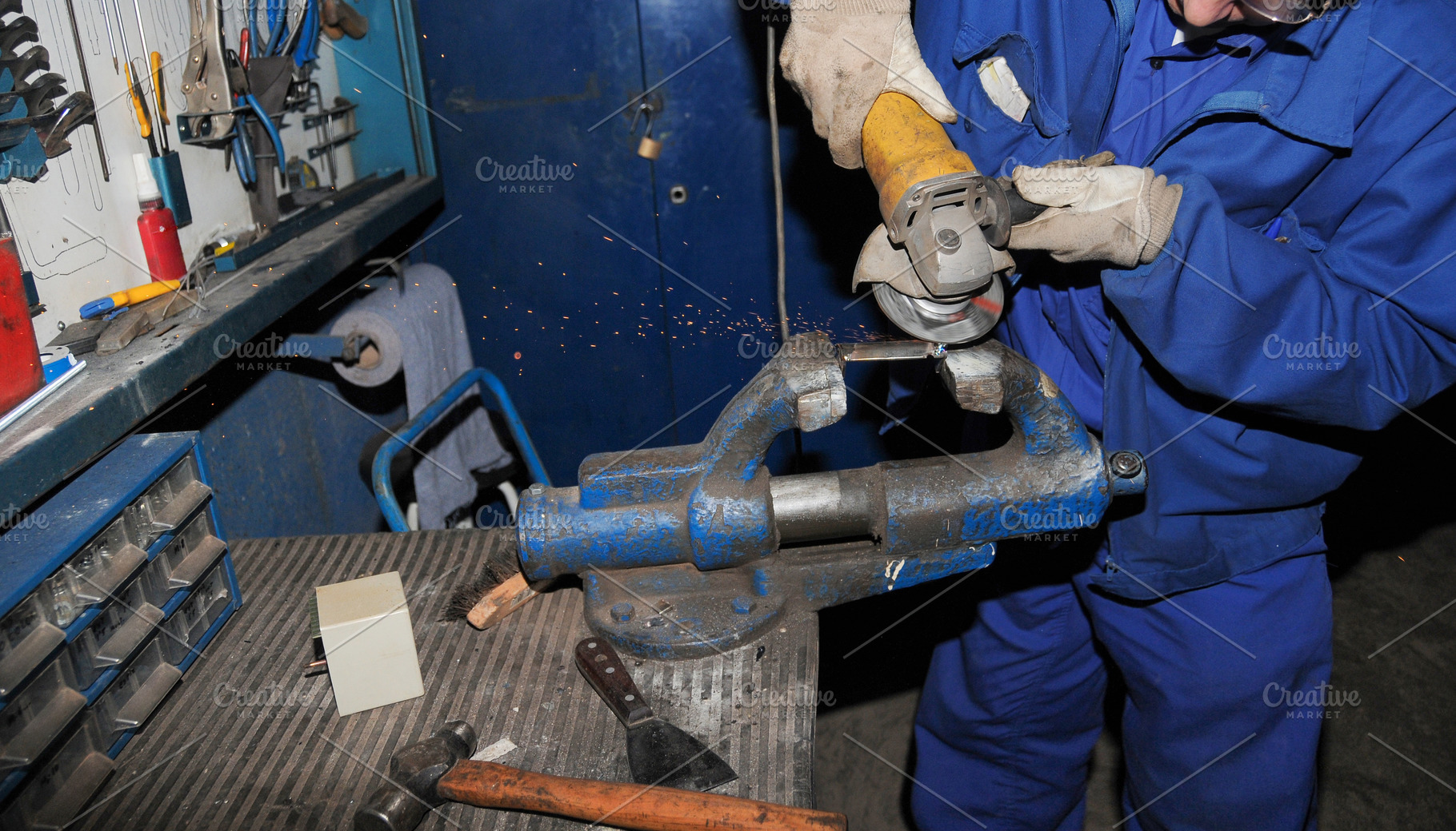 Worker Grinding Metal with Angle Grinder in Workshop, an Industrial Photo by Davizro's Market