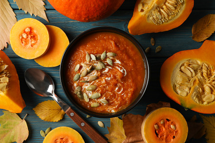 Composition with pumpkin soup with seeds on wooden background, t, a Food & Drink Photo by AtlasStudio PRO