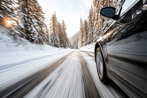 Black car speeding down an icy road, a Transportation Photo by MistyDay