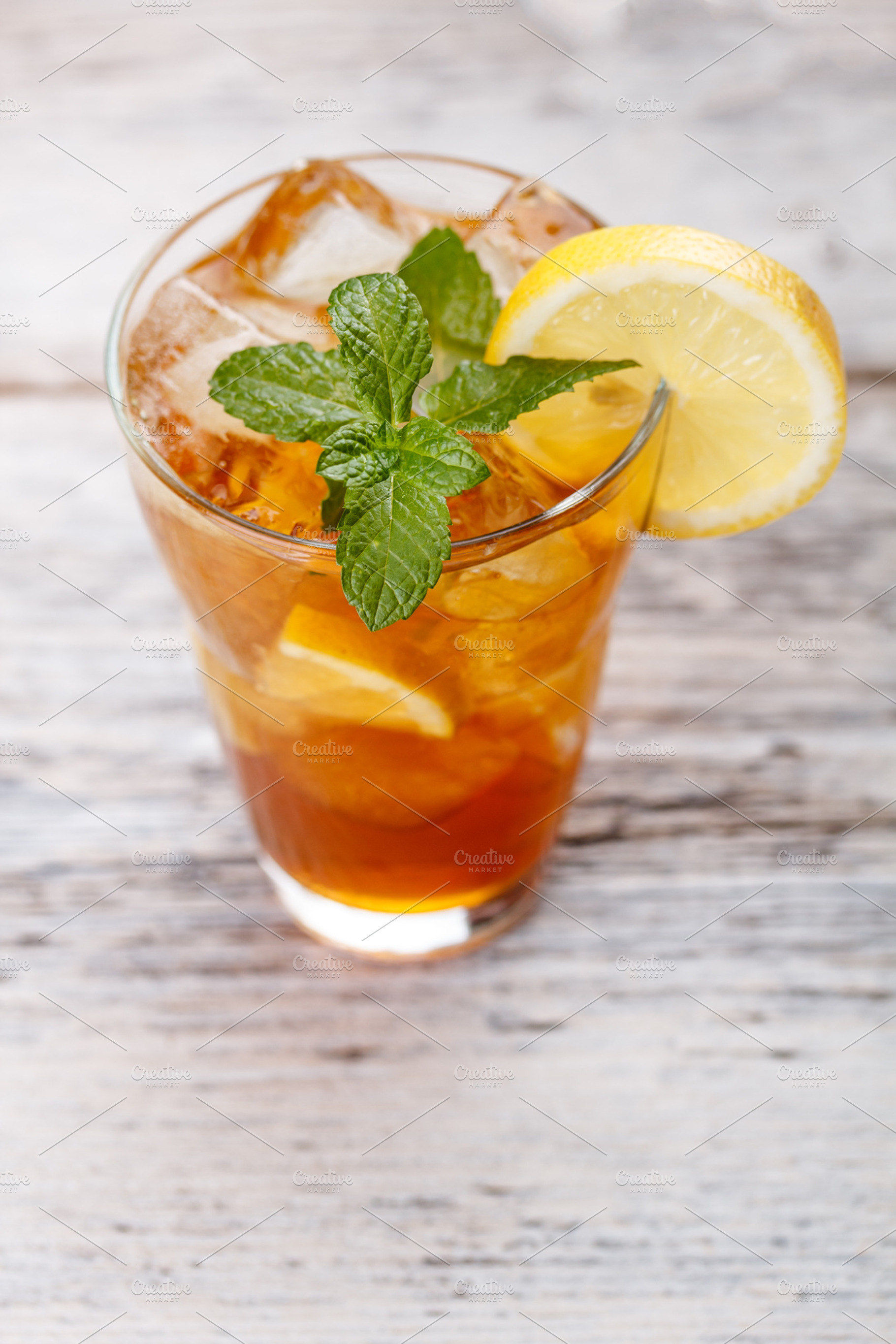 Iced tea containing tea, ice, and glass