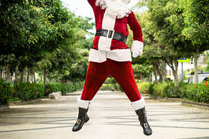 Santa Claus jumping in the air celebrating Christmas, a Person Photo by etorres69