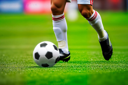 Soccer player dribbling ball