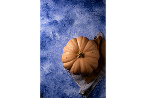 Raw fresh cut pumpkin on dark, a Food & Drink Photo by Yulia Furman