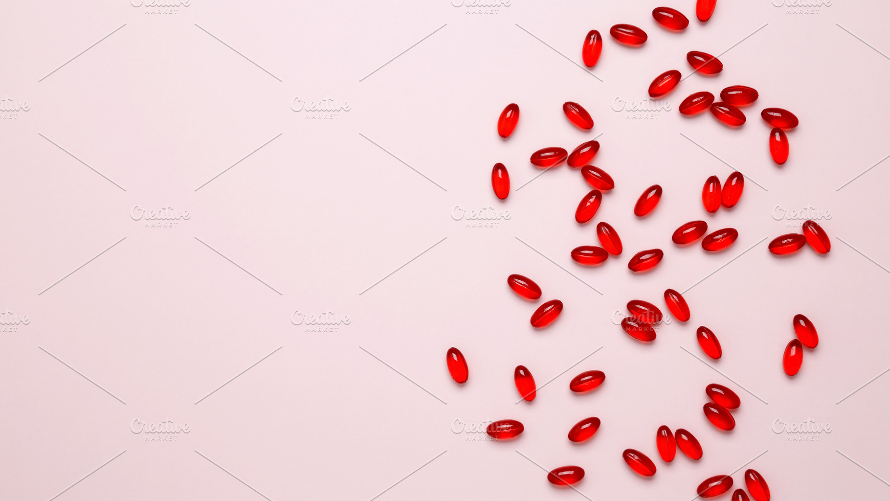 Concept of medicine, healthcare, and pharmaceutical industry. Red pills and cap, a Photo by matucha