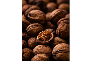 Walnuts with cracked shell texture, a Food & Drink Photo by Yulia Furman