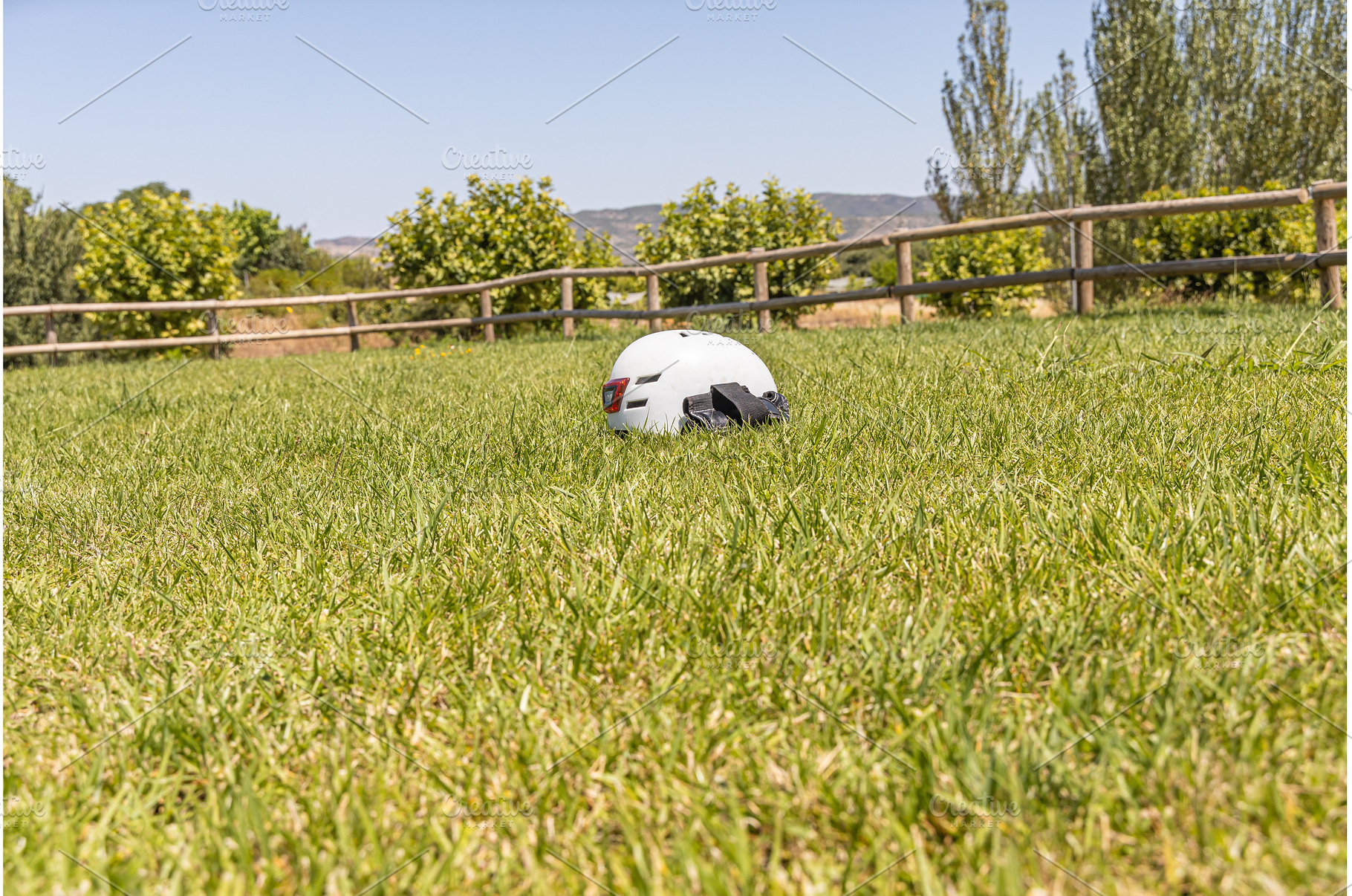 A white helmet on the green grass, a Technology Photo by Illustrations&photos