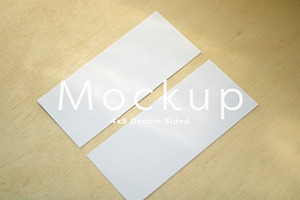 4x9 Card Mockup on Wood Background, a Print Template by ILLONA GRAPHICS