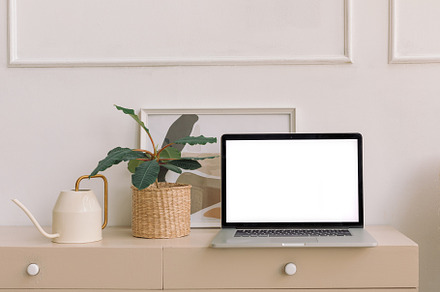 Laptop with blank screen on bureau