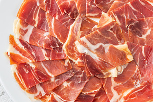 Thin Slices of Jamon Iberico, a Food & Drink Photo by Alexander Prokopenko
