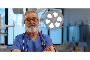 Portrait of doctor standing in, a Health & Medical Photo by HalfPoint