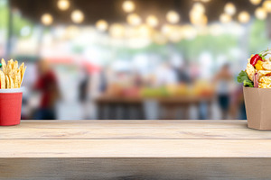 Mexican food with nachos, salsa and iced drinks on wooden table, a Photo by Dvoevnore photos