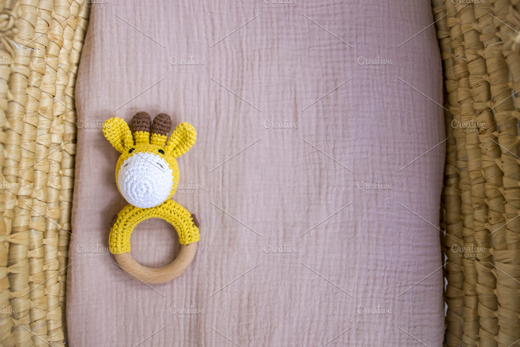 in a basket natural wooden knitted toys for a newborn. View from, a Beauty & Fashion Photo by TanaCh