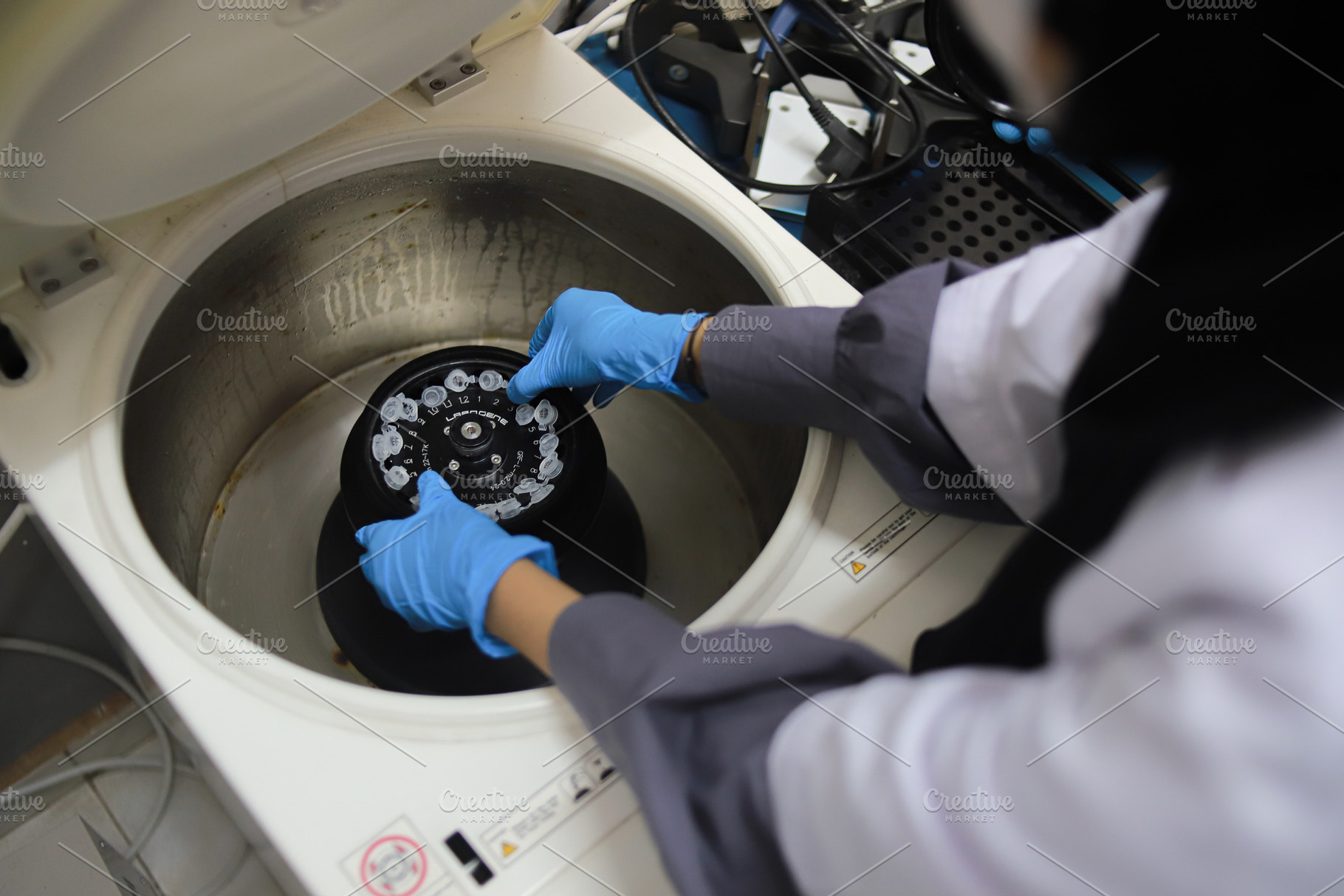 Laboratory Technician Loading Sample, a Health & Medical Photo by bastera