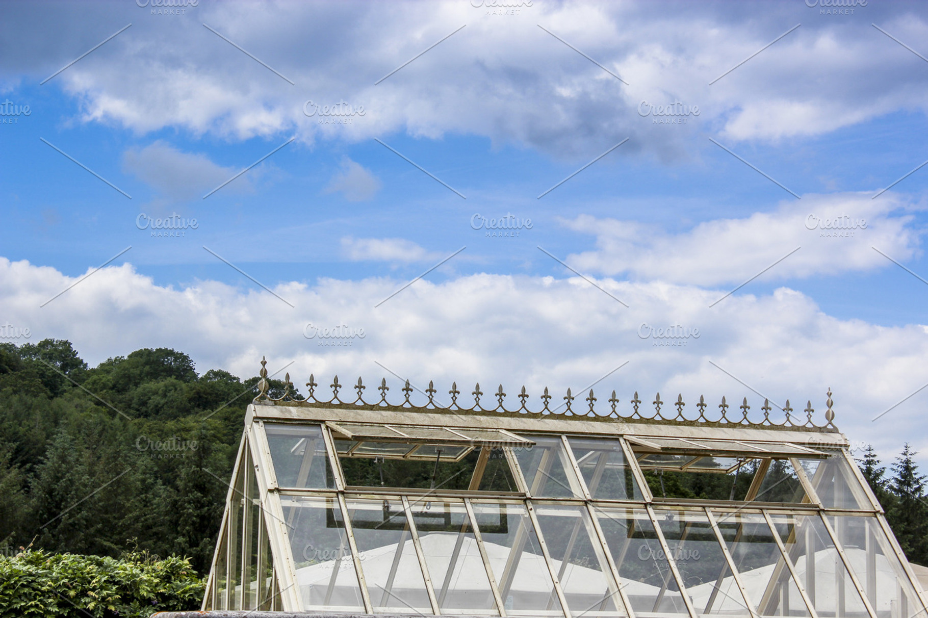 Green House Containing Green House Glass And Sky