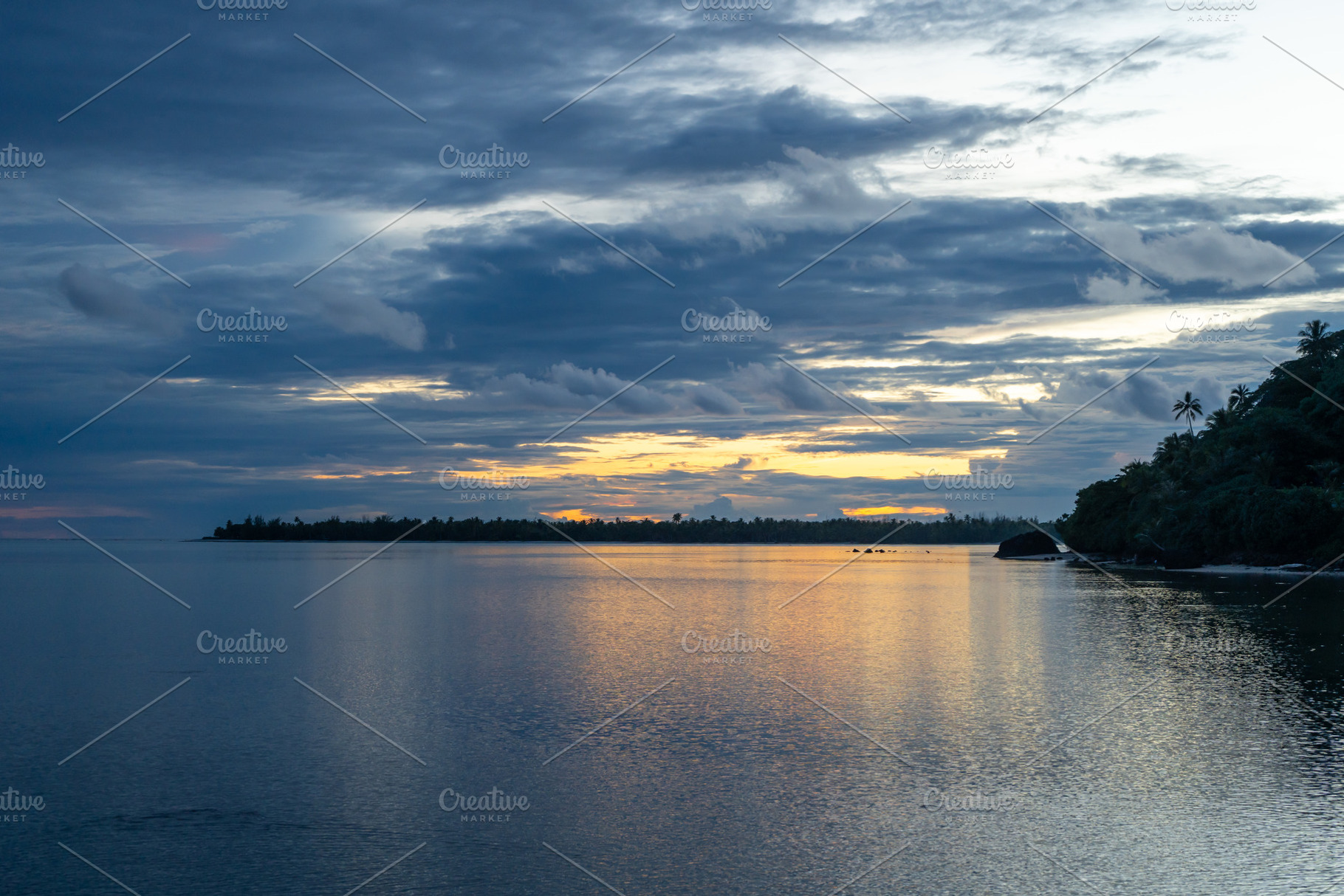 Sunset over the tranquil lagoon of Maupiti, French Polynesia, a Nature Photo by GoodGoods