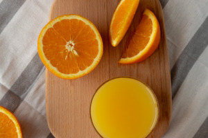 Organic Orange Juice in a Glass, top view. Overhead, from above,, a Food & Drink Photo by LiudmylaChuhunova