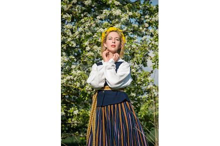 Beautiful feminime woman in national, a Holiday Photo by COLORFUL