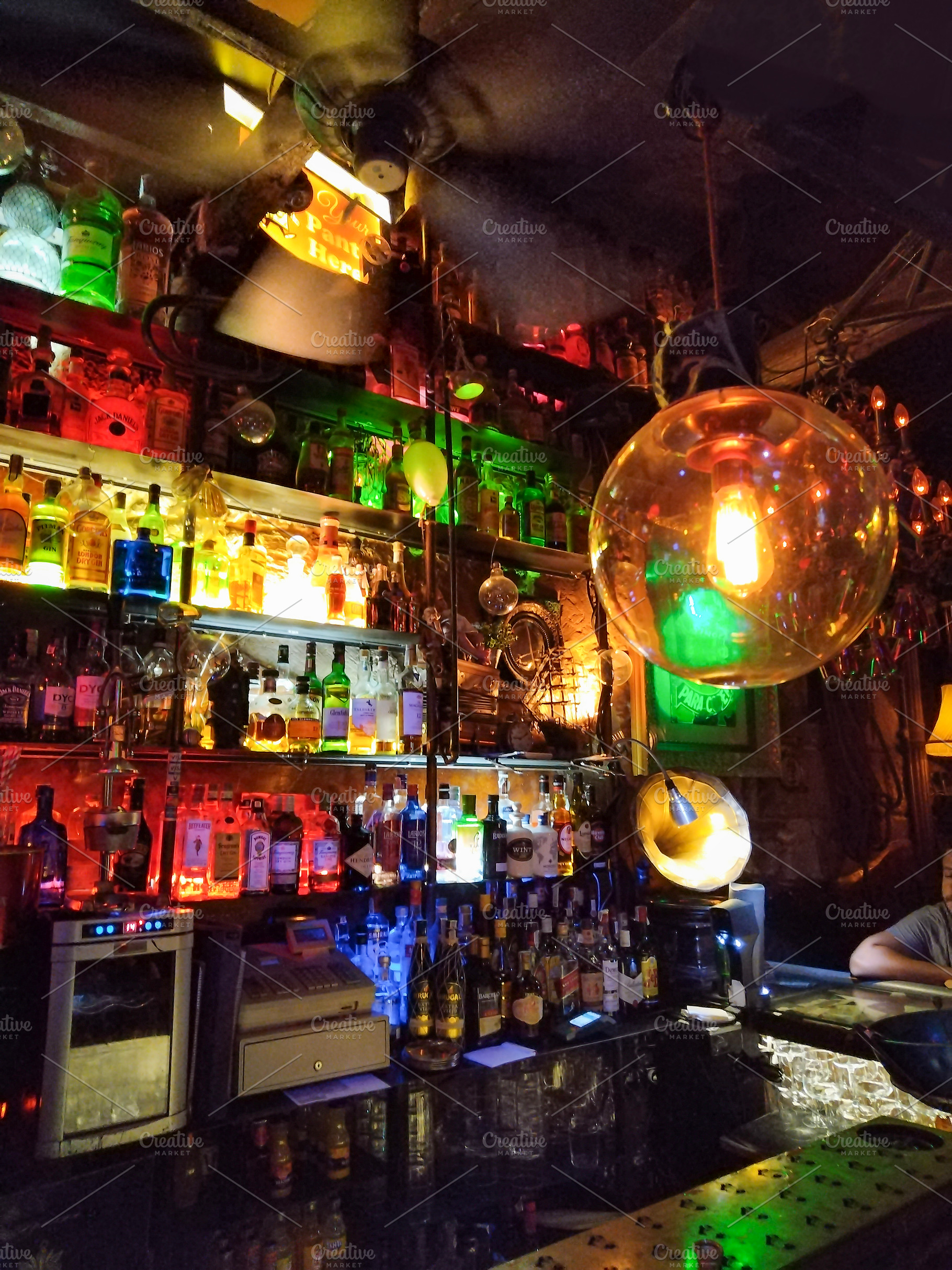 Colorful bar interior with neon lights and bottles, an Architecture Photo by DanFLCreativo
