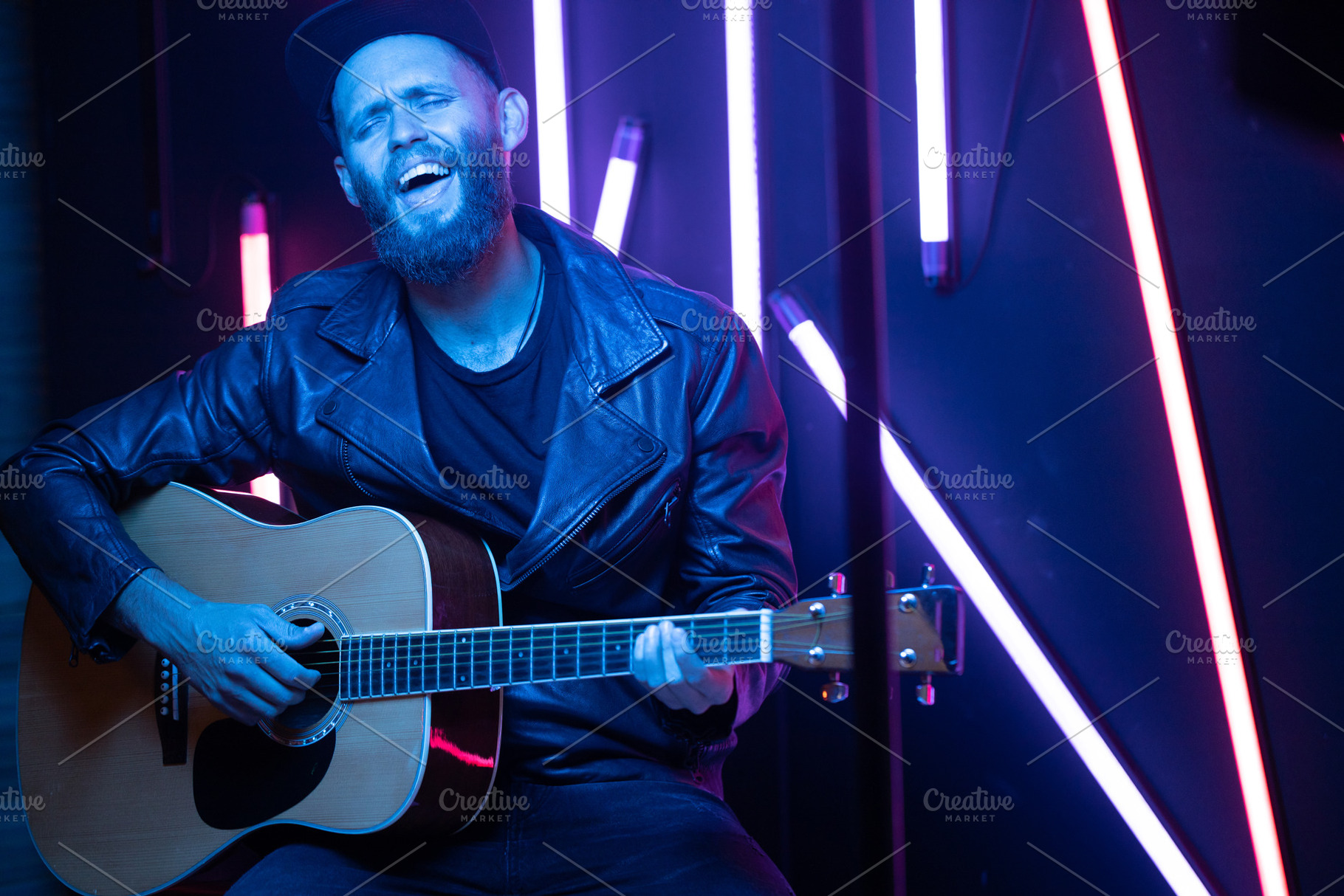 Singer and guitar player singing, an Arts & Entertainment Photo by 5max