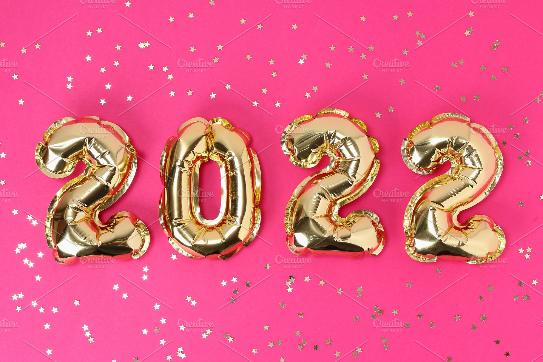 New Year 2022. Foil balloons numbers 2022 on pink background. New Year Christma, a Holiday Photo by Detriana