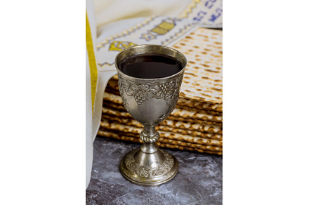 A cup of kosher kiddush wine is, a Holiday Photo by Ungvar Studio