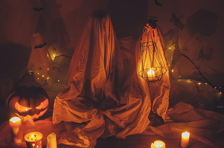 Scary ghost holding lantern in dark. Scary atmospheric halloween, a Holiday Photo by Sonjachni