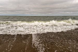 Foamy ocean wave splashing across sa, a Nature Photo by Elena Vagengeim