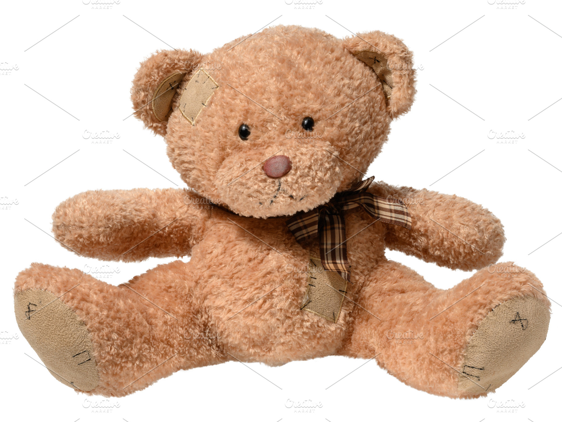Brown teddy bear sitting on isolated background, children's toy, an Abstract Photo by ndanko