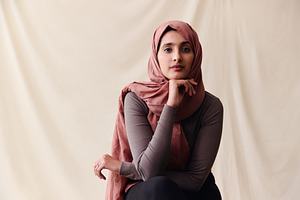 Portrait of confident young Middle Eastern woman wearing hajib looking at camer