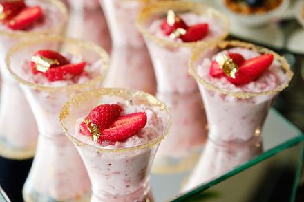 Elegant Strawberry Mousse Shooters with Gold Flakes.