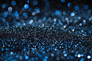 Tiny blue and silver particles shimm, a Photo by Tanuart