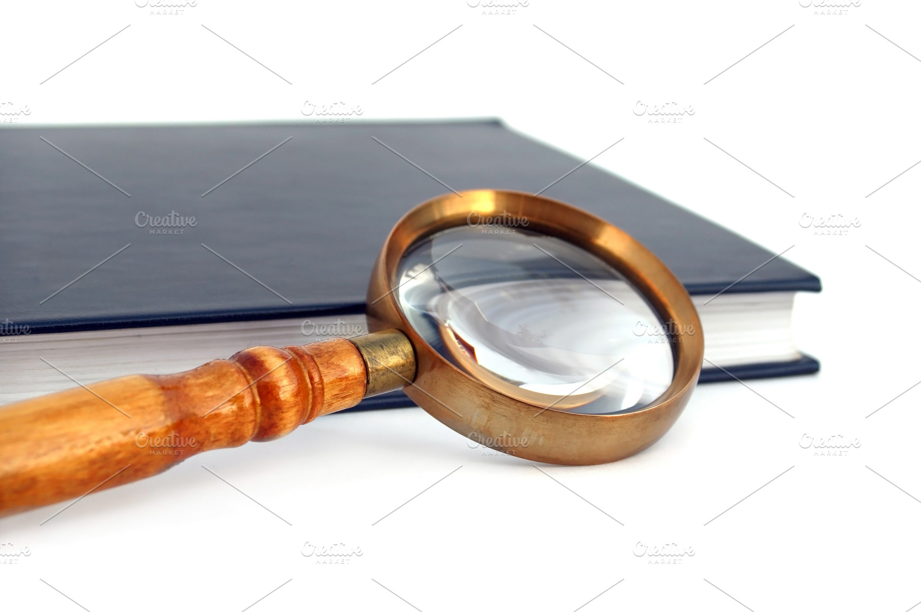 Old style magnifying glass isolated, a Photo by saiko3p