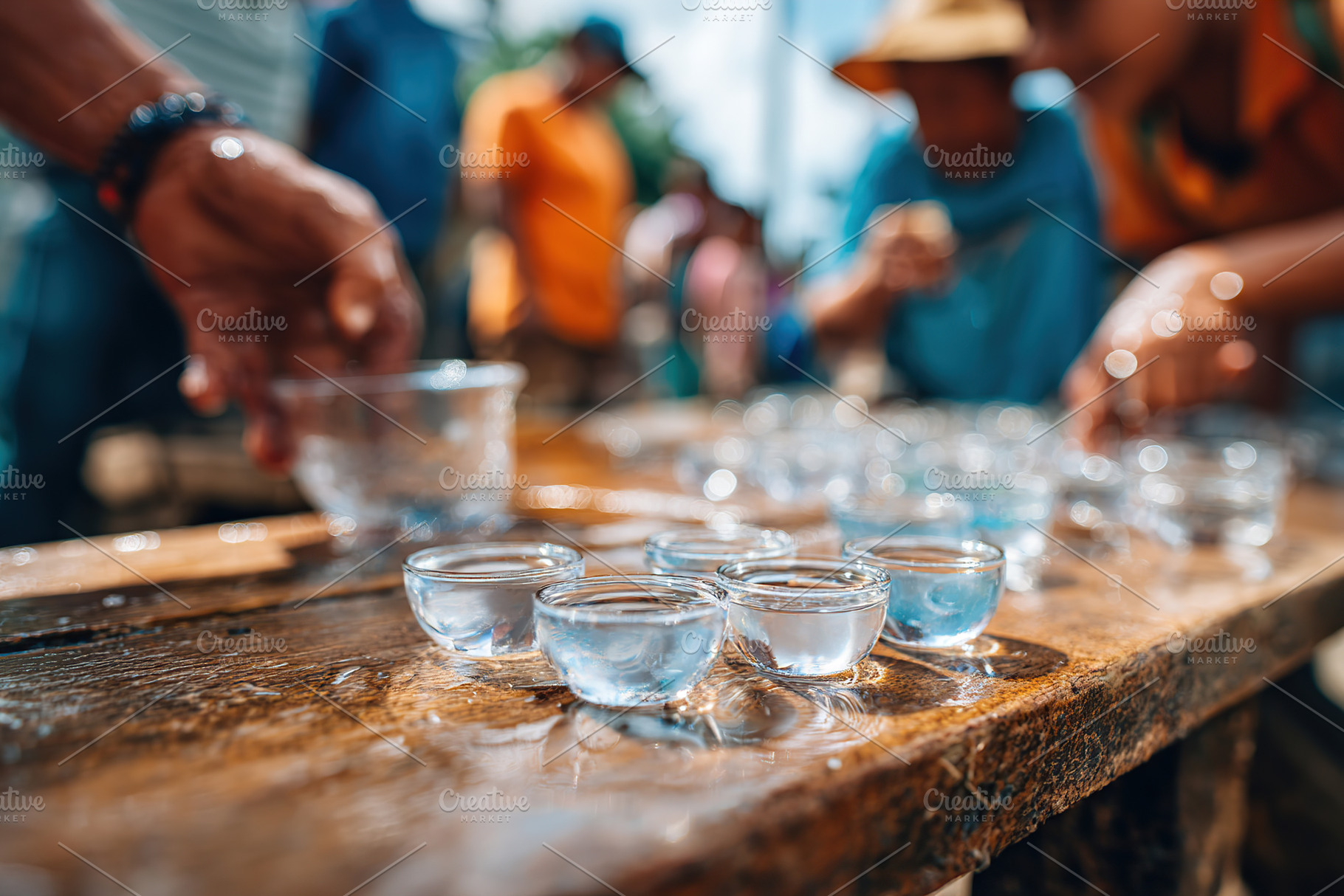 Water purification process using capsules in outdoor setting with community par, a Food & Drink Photo by AlyaAnd
