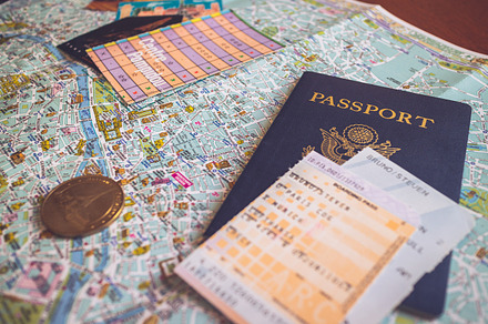 Passport sits on Map of Paris