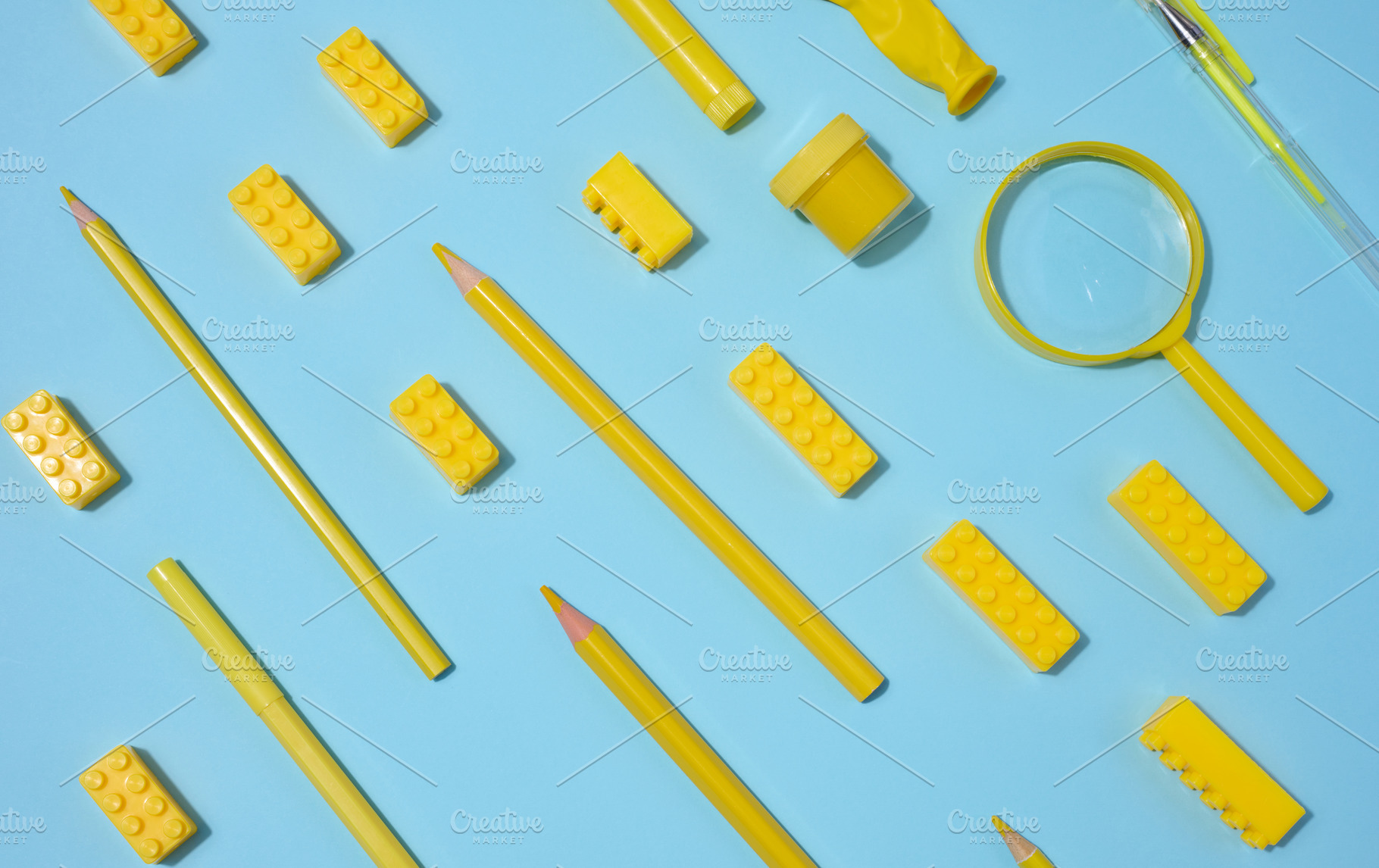 Various yellow objects including pencils, magnifying glass and t, an Abstract Photo by ndanko