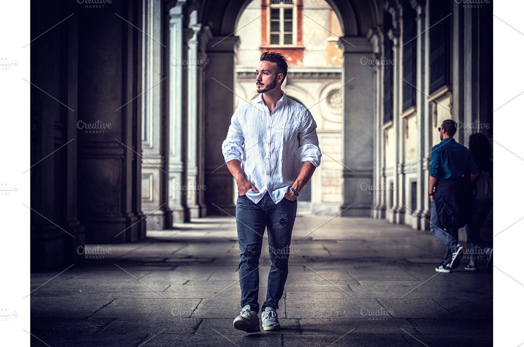 Young man in European city street, a Person Photo by ArtOfPhotos photo store
