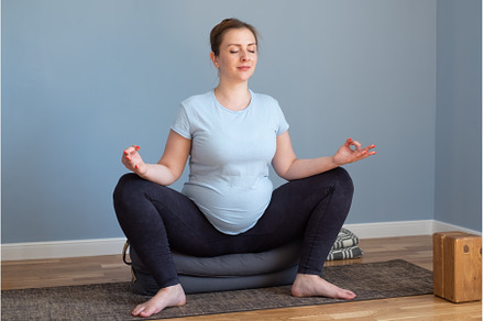 Pregnant yoga woman enjoying yoga, a Sports & Recreation Photo by Koldunov