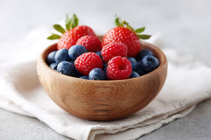 Fresh berries in a wooden bowl, a Food & Drink Photo by AlyaAnd