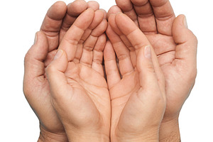 Two people, a man and a woman, clasped together in a cup or gest, a Person Photo by ndanko