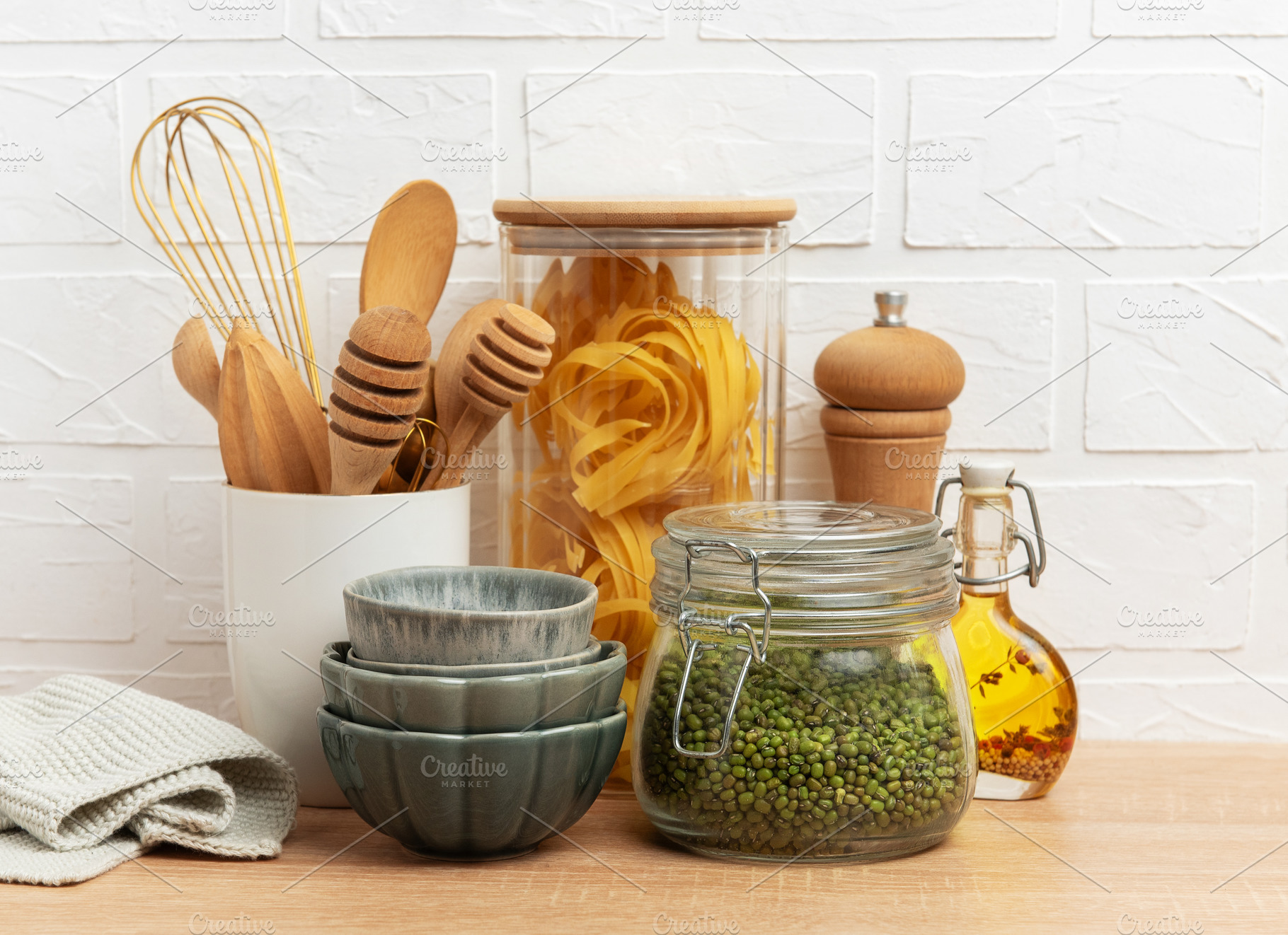 Kitchen utensils, pasta, mung beans and oil creating a cozy culi, a Food & Drink Photo by Olena Rudo