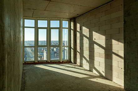 Empty rooms in a house under construction, an Industrial Photo by Photostock