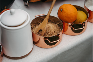 Fresh ingredients in copper pots, a Food & Drink Photo by HalfPoint