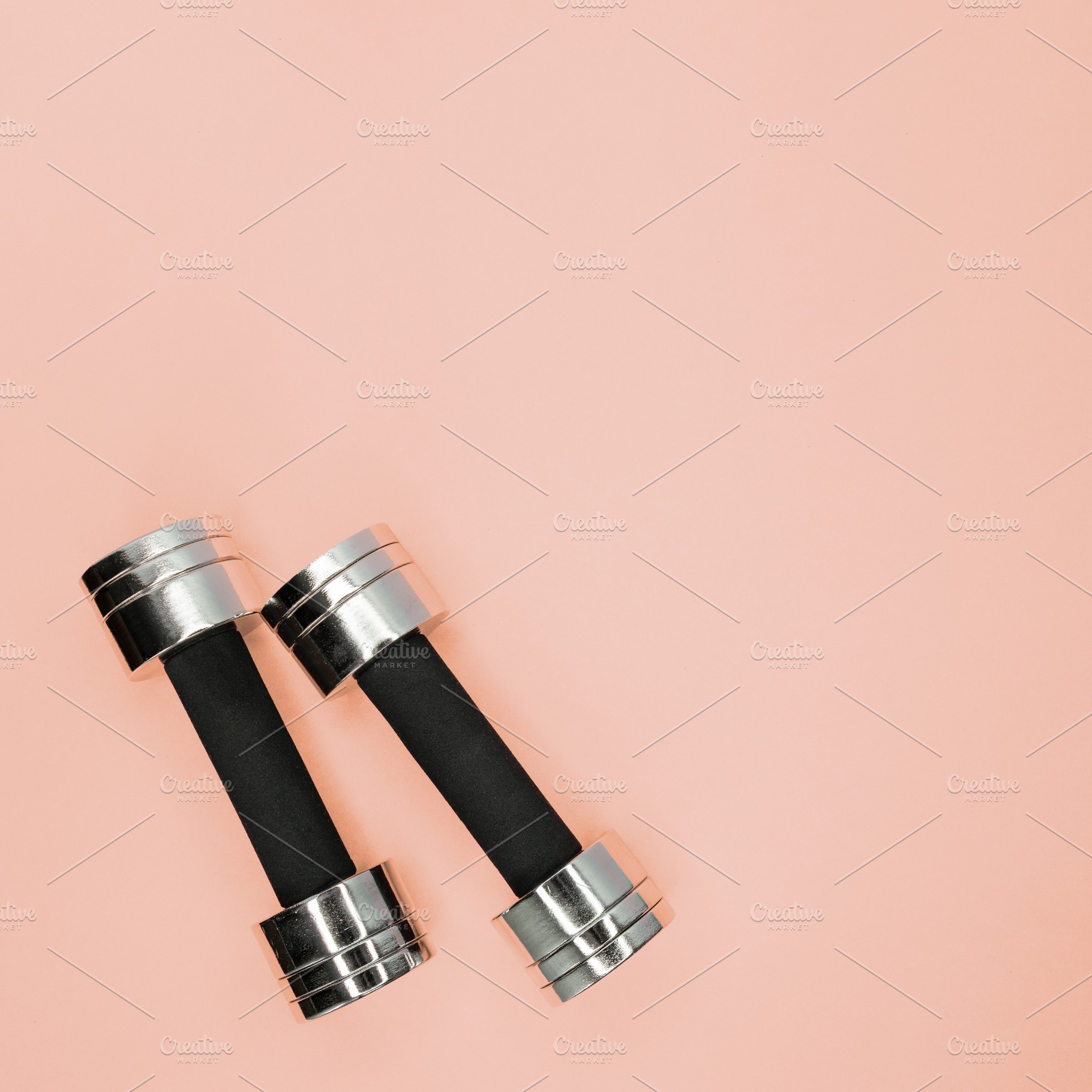 Metal small dumbbells on a pink containing workout, strength, and sport, a Sports & Recreation Photo by sport&beauty stock photo