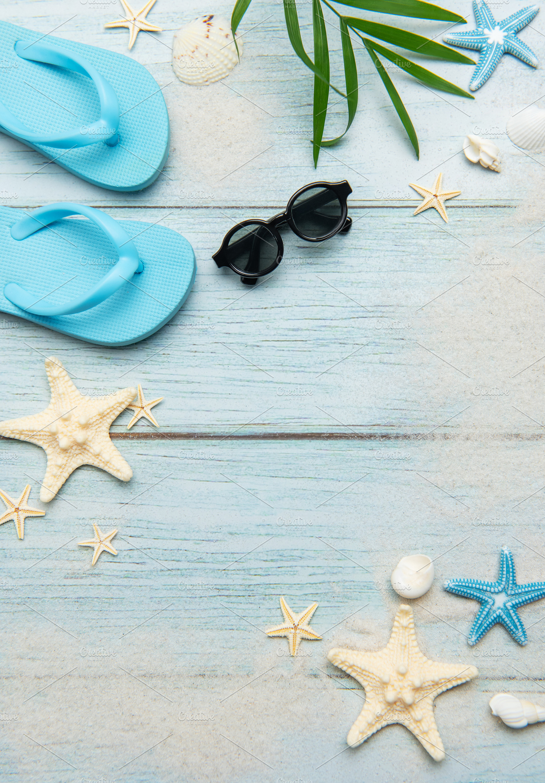 Summer beach essentials on wooden background, a Holiday Photo by Olena Rudo