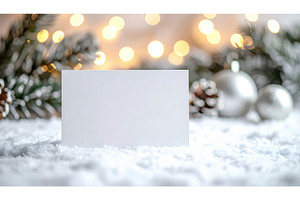 Blank white card on snowy surface, a Holiday Photo by Igor Tichonow
