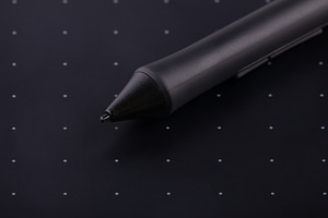 Close-up of a digital stylus resting on a black graphic tablet w, a Technology Photo by Ales Munt