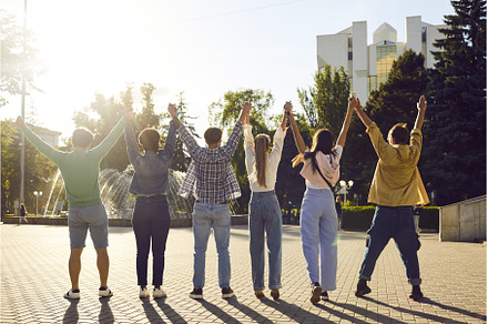Group of people standing in line, a Person Photo by StudioRomantic