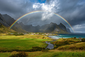 Rainbow over mountains and sea, a Photo by Beautiful things