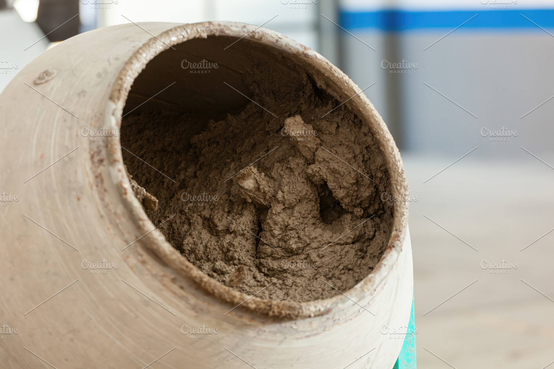 Cement mixer preparing concrete on construction site, an Industrial Photo by Antonio Gravante Market