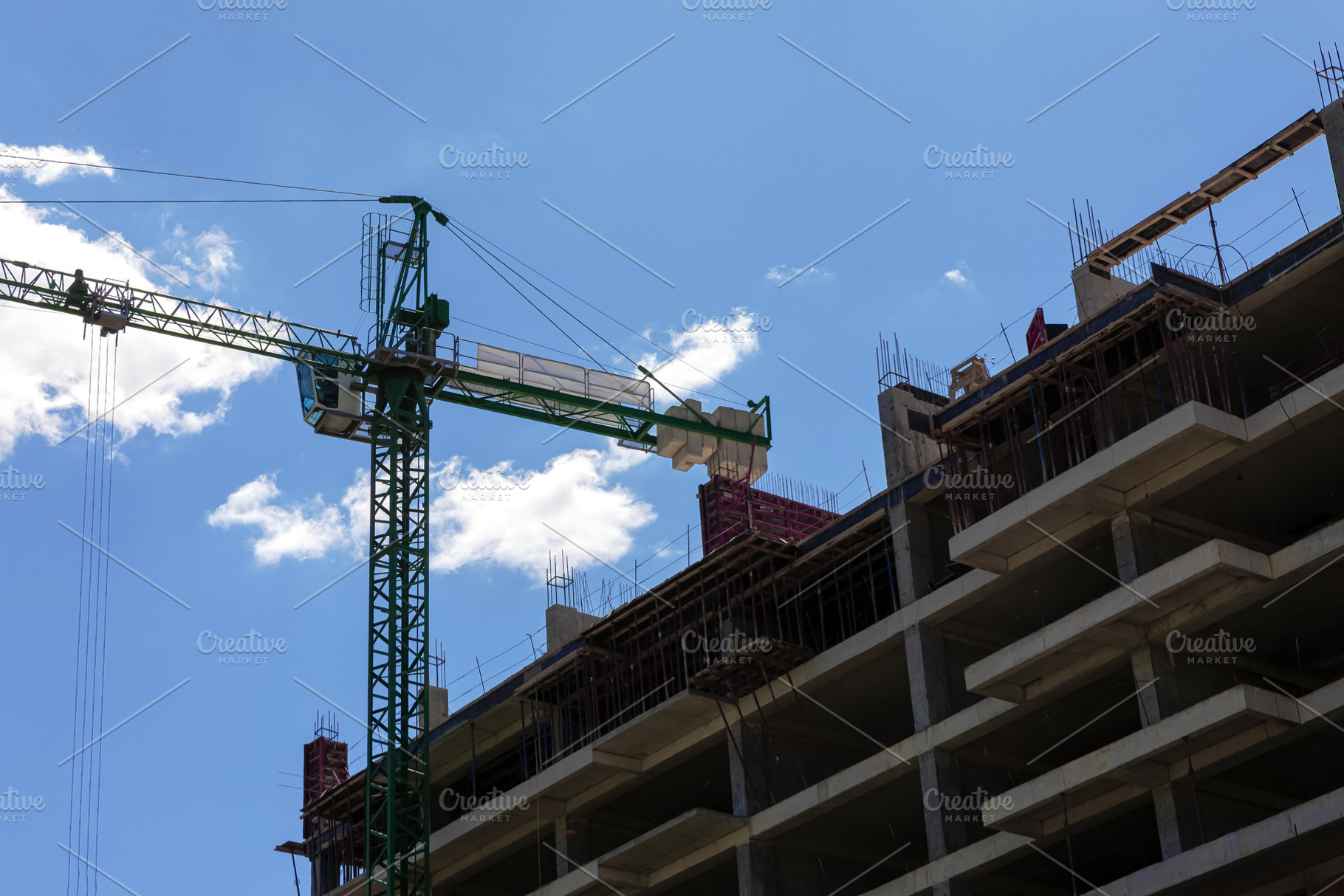 Low-angle view of a concrete building under construction with a, an Architecture Photo by Ales Munt